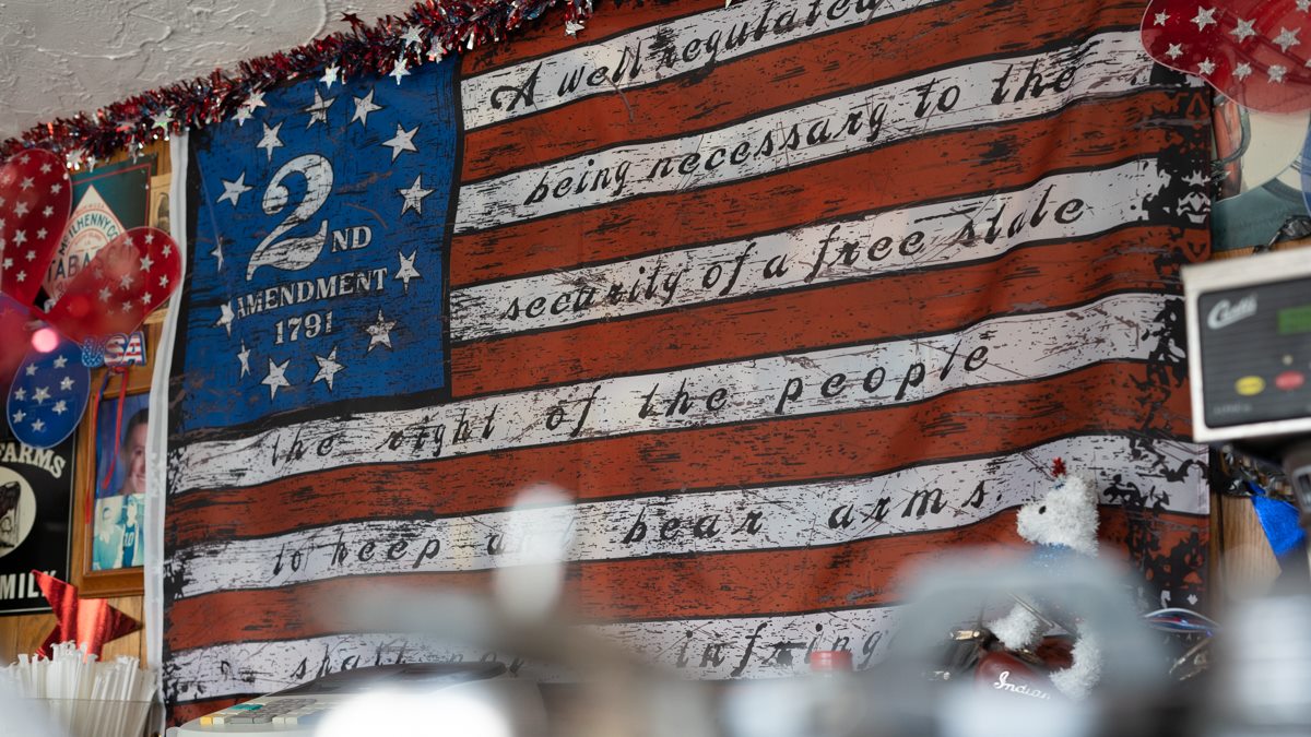 American flag on bar wall with writing on it