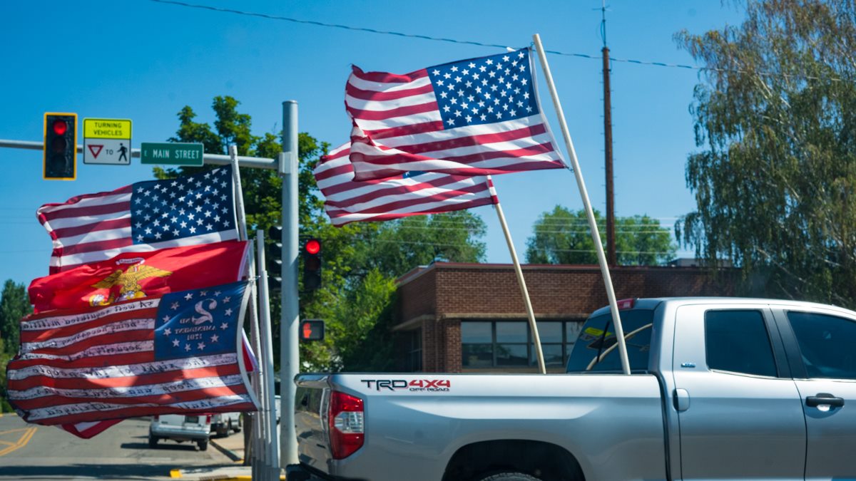 pickup truck with many american flags
