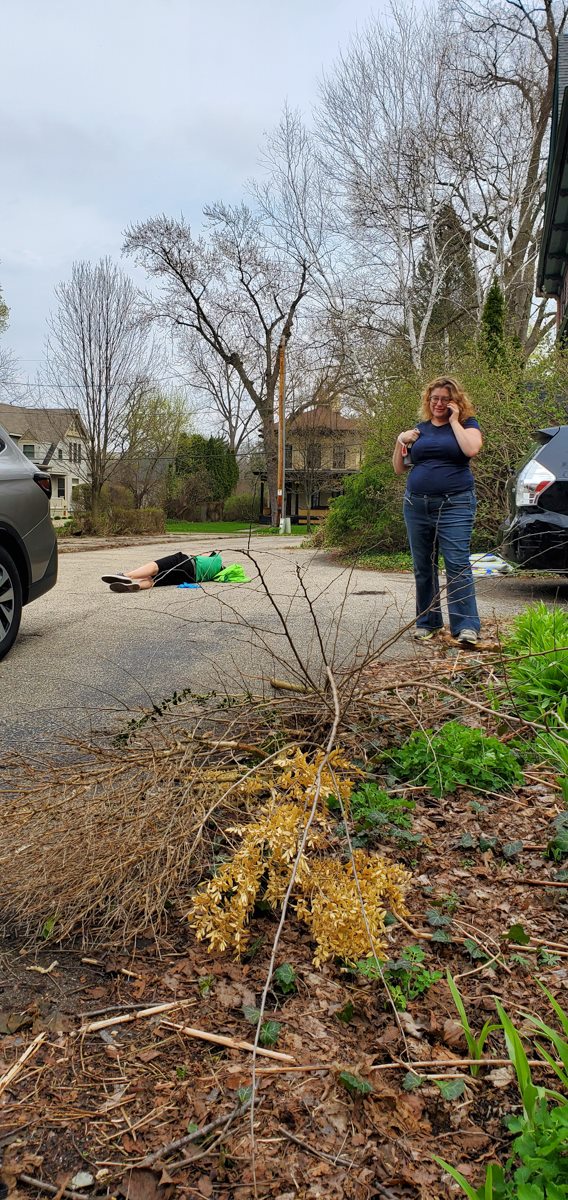 man on ground woman on the phone 