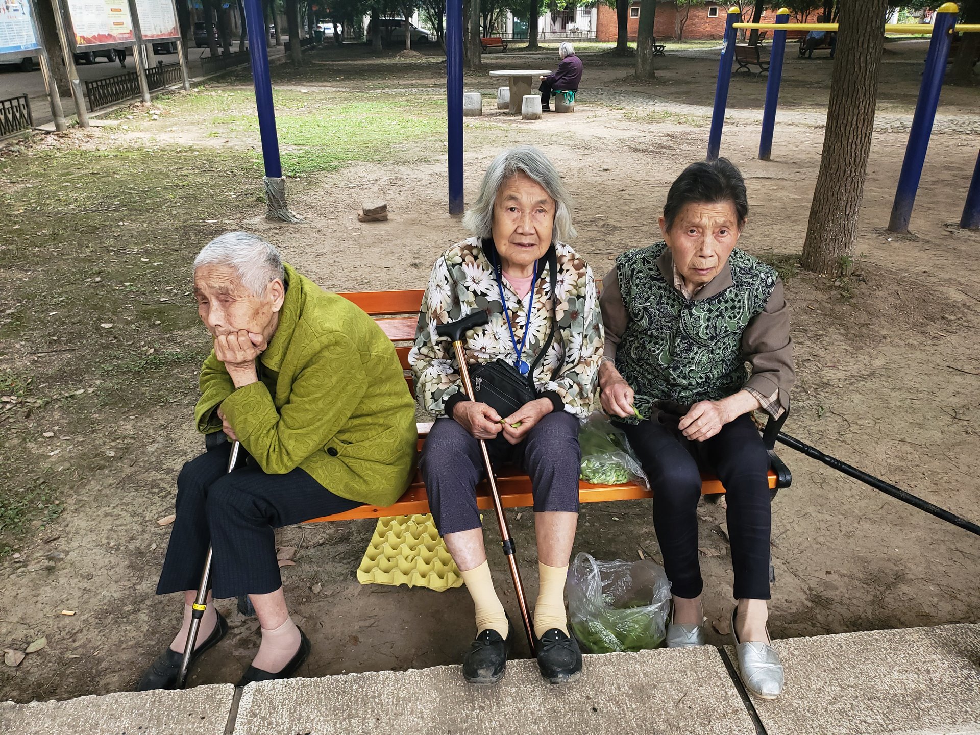 three old ladies on bench