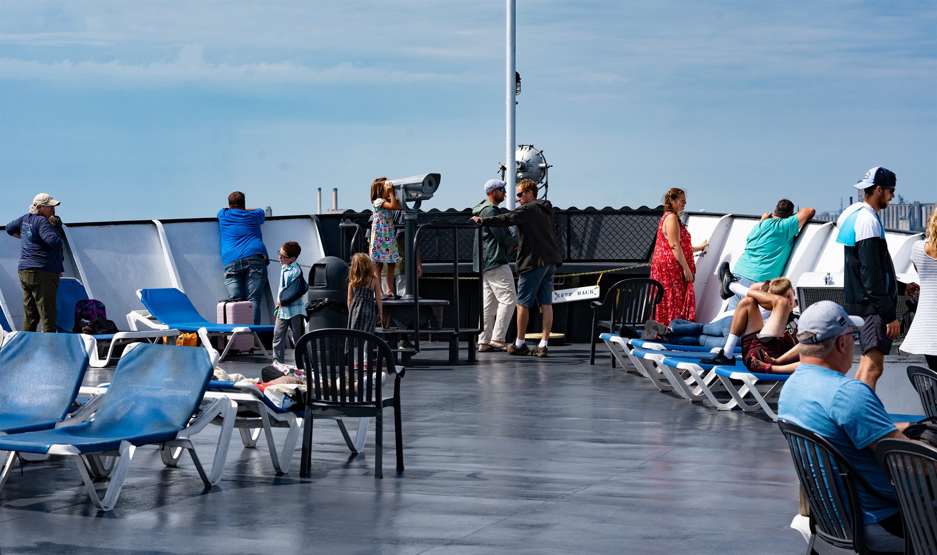 people on bow of boat