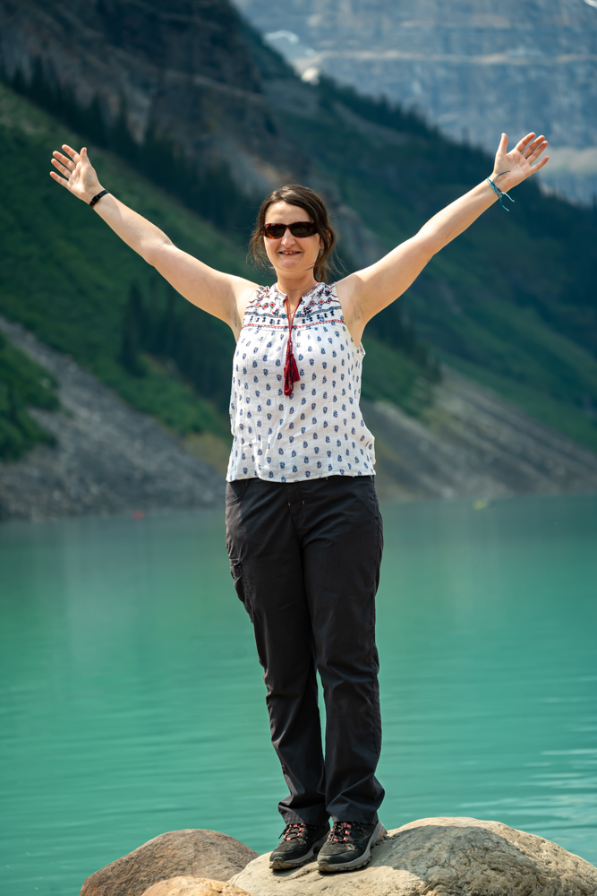 Woman with arms raised posing for picture