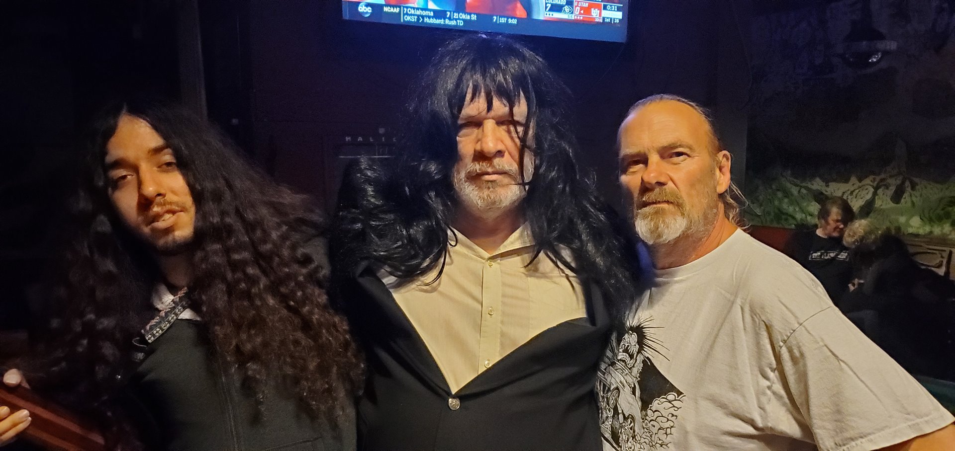 three men with wig
