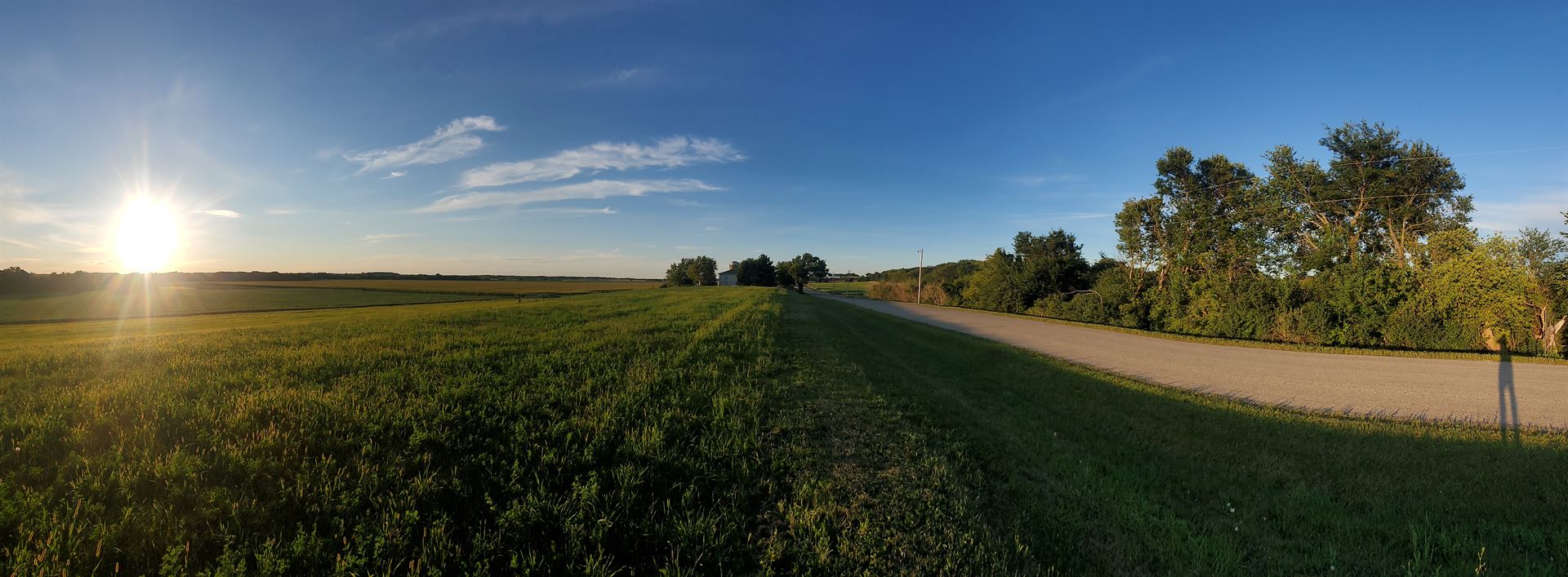panorama of farm land with my shadow 