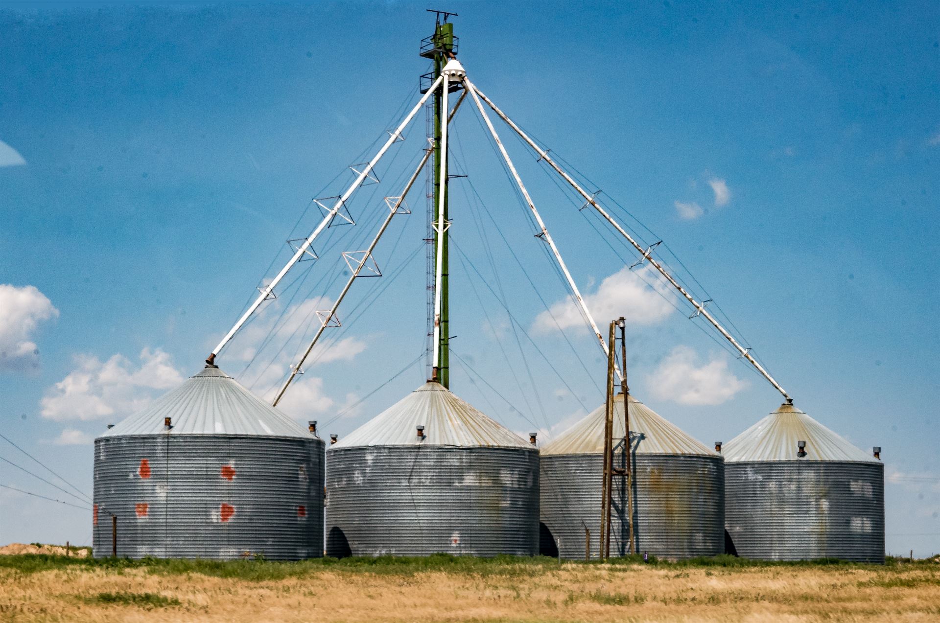 four silos in the distance