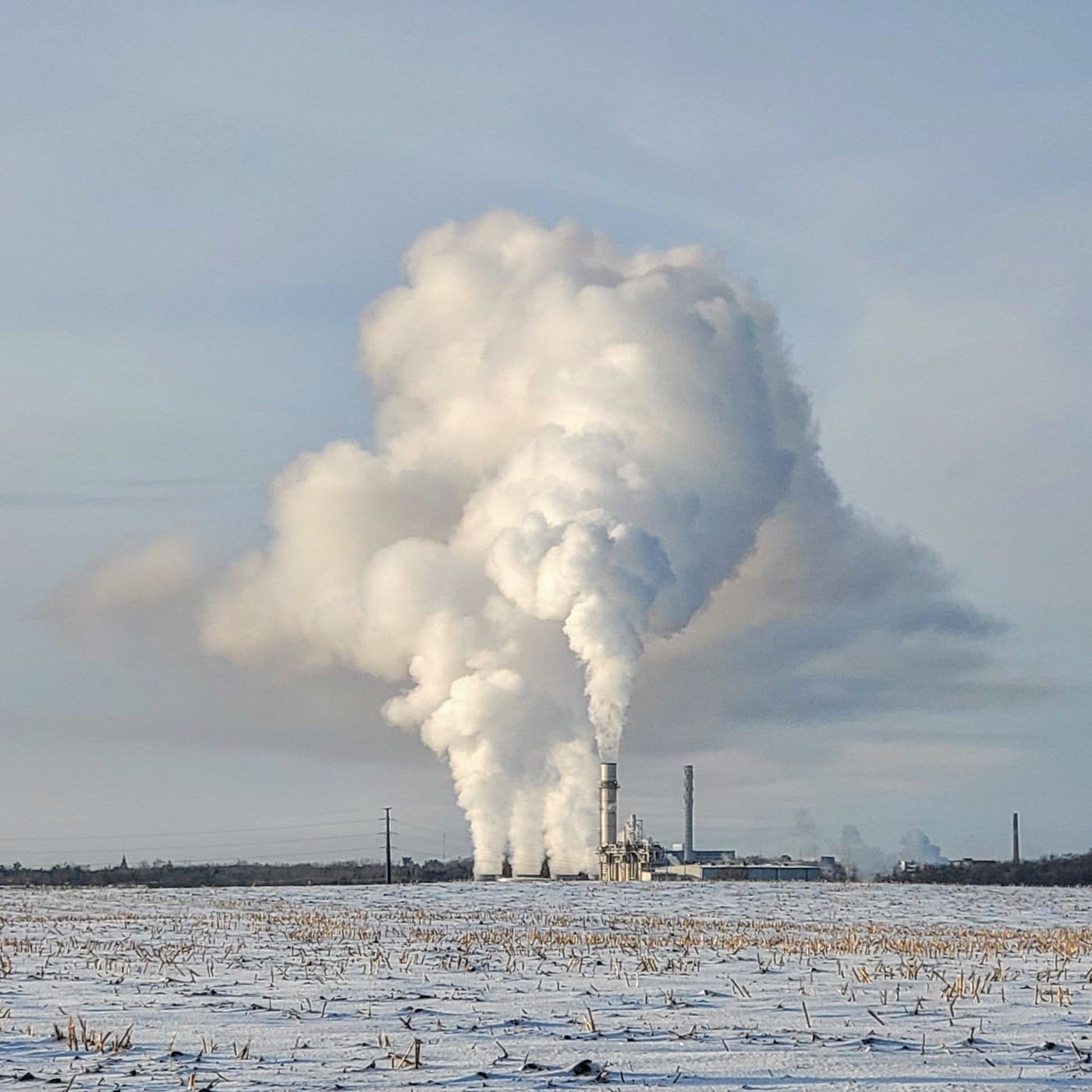 plume of steam from power plant in winter