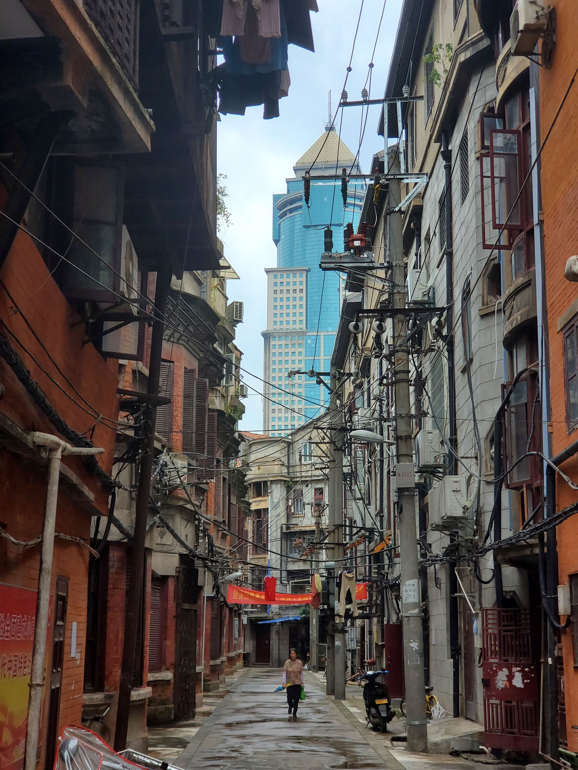 an alley in wuhan with buildings in the distance